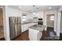 Modern kitchen featuring stainless steel appliances, granite countertops and an island at 4824 Harcourt Ln, Charlotte, NC 28212