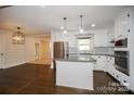 Modern kitchen featuring stainless steel appliances, granite countertops and an island at 4824 Harcourt Ln, Charlotte, NC 28212