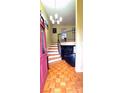 Inviting foyer with hardwood floors, staircase, and a stylish chandelier that creates a warm welcome at 5230 Northview Dr, Hickory, NC 28601