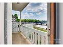 View from the balcony showing a beautiful lakeside landscape with a marina and greenery on a partly cloudy day at 7831 Spinnaker Bay Dr # 106, Sherrills Ford, NC 28673