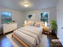 Cozy bedroom with hardwood floors, soft lighting, and bright windows at 1429 Alexander Rd, Rock Hill, SC 29732