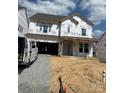 New two-story home showcasing modern design, large windows, and pre-construction wrapped facade at 164 Holsworthy Dr, Mooresville, NC 28115