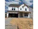 New two-story home under construction, showcasing the home's facade and future landscaping at 166 Holsworthy Dr, Mooresville, NC 28115