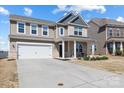 Beautiful home showcasing a two-car garage and inviting entrance at 1875 Loggerhead Dr, Lancaster, SC 29720