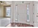 Bright foyer with hardwood floors and a view of a carpeted room with a fan at 242 Tradition Way, Rock Hill, SC 29732