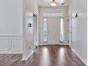 Inviting foyer with hardwood floors, neutral paint, and natural light streaming through the front door at 242 Tradition Way, Rock Hill, SC 29732
