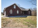 Classic brick home with an attached garage and a well-kept lawn at 28926 Hartsell Rd, Albemarle, NC 28001