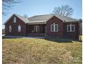 Charming brick home with a welcoming front porch and well-maintained lawn at 28926 Hartsell Rd, Albemarle, NC 28001