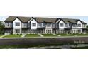 Attractive townhome exteriors feature white siding, gray accents, and well-manicured lawns at 3105 Beacon Heights Rd, Indian Land, SC 29707