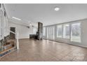 Expansive living area with stone fireplace and large windows offering natural light at 3607 Austin Rd, Monroe, NC 28112