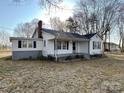 Attractive single-Gathering home with white siding, black shutters, and a welcoming front porch with a classic chimney at 3672 Nc Hwy 127 Hwy, Hickory, NC 28602
