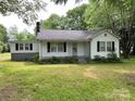 Traditional-style home featuring a cozy front porch, clean white siding and classic black shutters at 3672 Nc Hwy 127 Hwy, Hickory, NC 28602