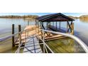 Close up of the dock area with seating and boat storage on the lake at 4046 Rhynland Dr, Sherrills Ford, NC 28673