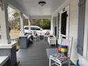 Charming front porch featuring inviting seating and decorative gray columns at 412 E Ross Grove Rd, Shelby, NC 28150