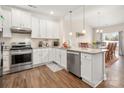 Open kitchen design with stainless steel appliances and granite countertops at 4427 Allenby Pl, Monroe, NC 28110