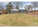 Quaint one-story home with gray brick, fresh exterior paint, and a spacious front yard at 510 Colony Acres Dr, Charlotte, NC 28217