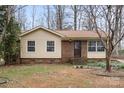 Single-story home with a mix of vinyl siding and brick, complemented by a simple, landscaped front yard at 515 Culloden Ct, Charlotte, NC 28214