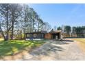Charming one-story home with a landscaped yard, a carport, and newly painted exterior at 627 Westway Dr, Gastonia, NC 28054