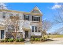 Charming townhome showcasing stone accents, a neutral palette, and a welcoming front entrance at 9108 Ainslie Downs St, Charlotte, NC 28273