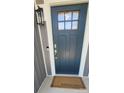 Close-up of a stylish front door with a 'welcome home' mat at 1123 Fieldstone Rd, Mooresville, NC 28115