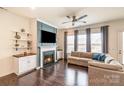 Inviting living room with fireplace, TV, and dark wood floors at 19011 Dry Narrows Way, Charlotte, NC 28278