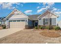 Well maintained single-Gathering home with stone accents and a two-car garage at 4317 Stream Dale Nw Cir, Concord, NC 28027
