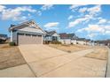 Exterior view of single Gathering homes with well manicured lawns and sidewalks at 4317 Stream Dale Nw Cir, Concord, NC 28027