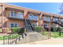 Charming brick apartment building featuring private balconies and inviting staircases, perfect for modern urban living at 452 S Main St # F, Davidson, NC 28036