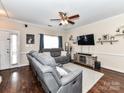 Spacious living area with hardwood floors, a large window, comfortable seating, and a ceiling fan at 4708 Chantress Ln, Monroe, NC 28110