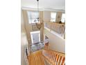 Grand foyer with a soaring ceiling, a decorative chandelier, and hardwood floors leading to the upper level at 10625 Olde Irongate Ln, Mint Hill, NC 28227
