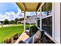 Relaxing front porch with comfortable seating overlooking the manicured lawn at 116 Dublin Ct, Statesville, NC 28677