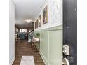 Welcoming hallway with stylish decor and a view of the modern kitchen at 116 Dublin Ct, Statesville, NC 28677