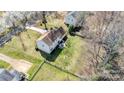A beautiful aerial shot of a home with a spacious backyard in a residential neighborhood setting at 11929 Parks Farm Ln, Charlotte, NC 28277
