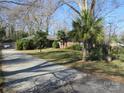 Inviting brick home featuring a paved driveway and well-manicured front yard at 215 Bailey Ave, Rock Hill, SC 29732