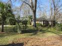 Cozy brick home with mature trees and a verdant front lawn at 215 Bailey Ave, Rock Hill, SC 29732