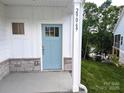Charming light-blue front door with stone accents and house number at 29069 Low Country Ln # 602, Lancaster, SC 29720