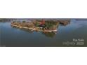 Aerial shot of lake home on a peninsula surrounded by water, offering privacy and scenic views at 340 Topsail Rd, Salisbury, NC 28146