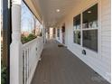 Long covered front porch with white railings, offering outdoor living space at 412 Montana Dr, Gastonia, NC 28056