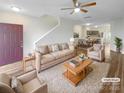 Spacious living room with modern furniture, including a plush sofa and chairs at 8813 Gerren Ct, Charlotte, NC 28217
