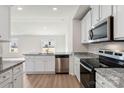 Modern kitchen with stainless steel appliances, granite countertops, and ample cabinet space at 117 Lightning Dr, Shelby, NC 28152