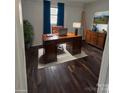 Office with a large wooden desk, a comfortable chair, and bright window at 1224 Hollywood Ter, Albemarle, NC 28001