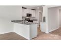 Kitchen with granite countertops, stainless steel appliances, and open floorplan at 123 Lightning Dr, Shelby, NC 28152
