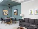 Relaxing living area and dining space with modern light fixtures, neutral colors and stylish decor at 19035 Newburg Hill Rd, Davidson, NC 28036