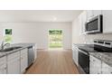 The kitchen flows into the bright living room, perfect for modern living at 3328 Burberry Dr, Gastonia, NC 28052