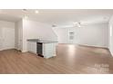 Spacious living room and modern flooring with a view of the kitchen area at 3328 Burberry Dr, Gastonia, NC 28052