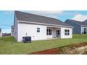 The backyard features a covered patio and a well-manicured lawn at 4044 Bolo Dr, Charlotte, NC 28215
