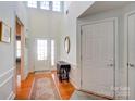 Bright foyer with hardwood floors, double doors, and decorative wainscoting at 41108 Calla Lily St, Fort Mill, SC 29707