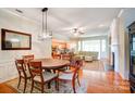 Open-concept living space with a dining area, fireplace, and views of the living room at 41108 Calla Lily St, Fort Mill, SC 29707