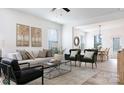 Bright, open living room with neutral tones, modern furnishings, and hardwood flooring at 5127 Izzo Ln, Charlotte, NC 28214