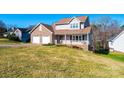 Charming two-story home featuring a brick facade, covered porch, two-car garage, and well-manicured lawn at 538 30Th Avenue Ne Cir, Hickory, NC 28601